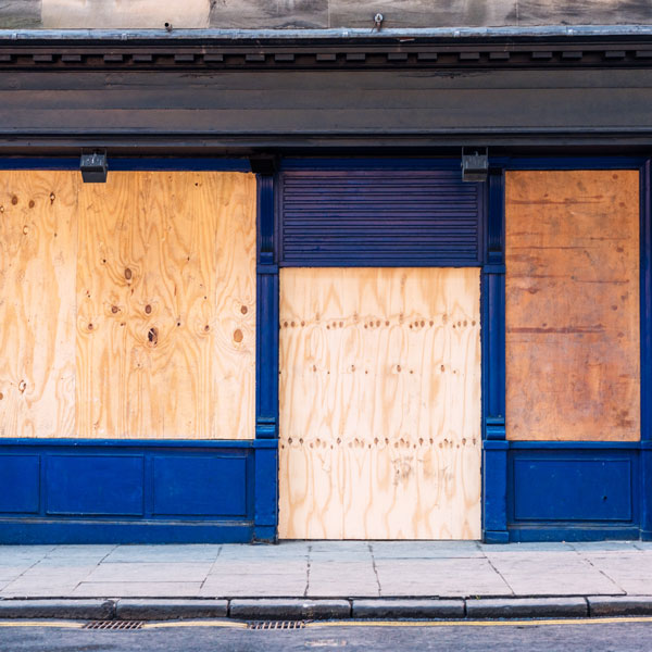business with boarded up windows