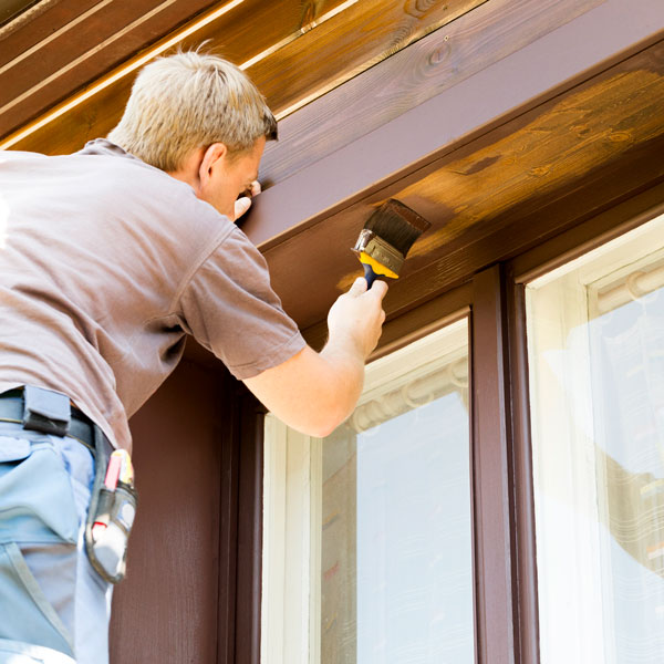 man painting home